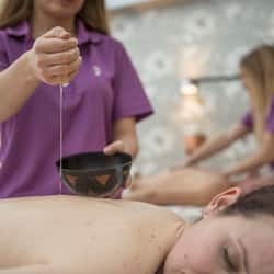 Expert therapists offer soothing massages in a serene spa setting.