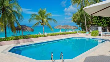 Outdoor pool, pool umbrellas, sun loungers