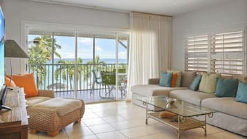 Condo 17, 2 Bedrooms, Ocean View | Living area | 32-inch TV with cable channels