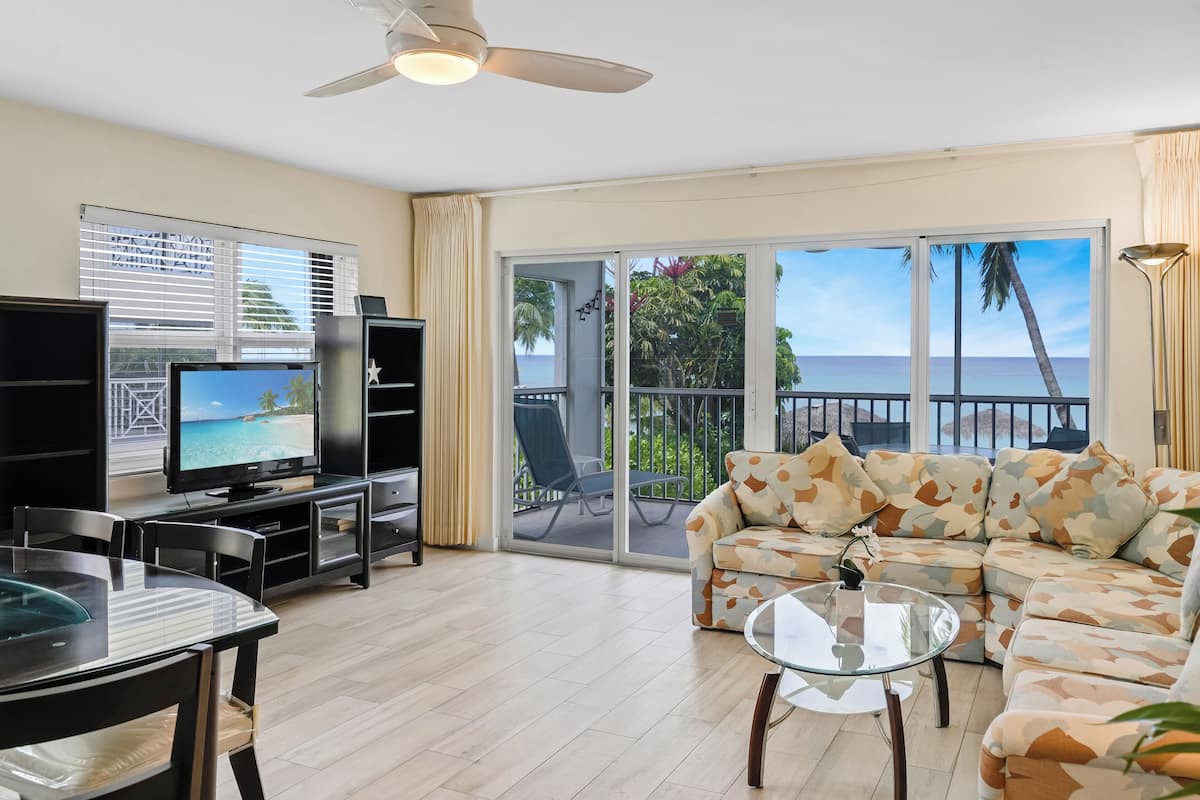Condo 8, 2 Bedrooms, Ocean View | Living area | 32-inch TV with cable channels