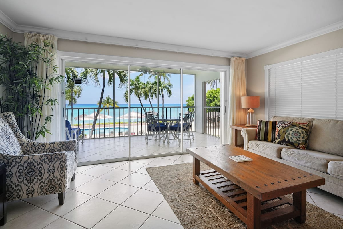 Condo 12, 2 Bedrooms, Ocean View | Living area | 32-inch TV with cable channels