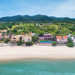 On the beach, white sand, beach umbrellas, beach towels