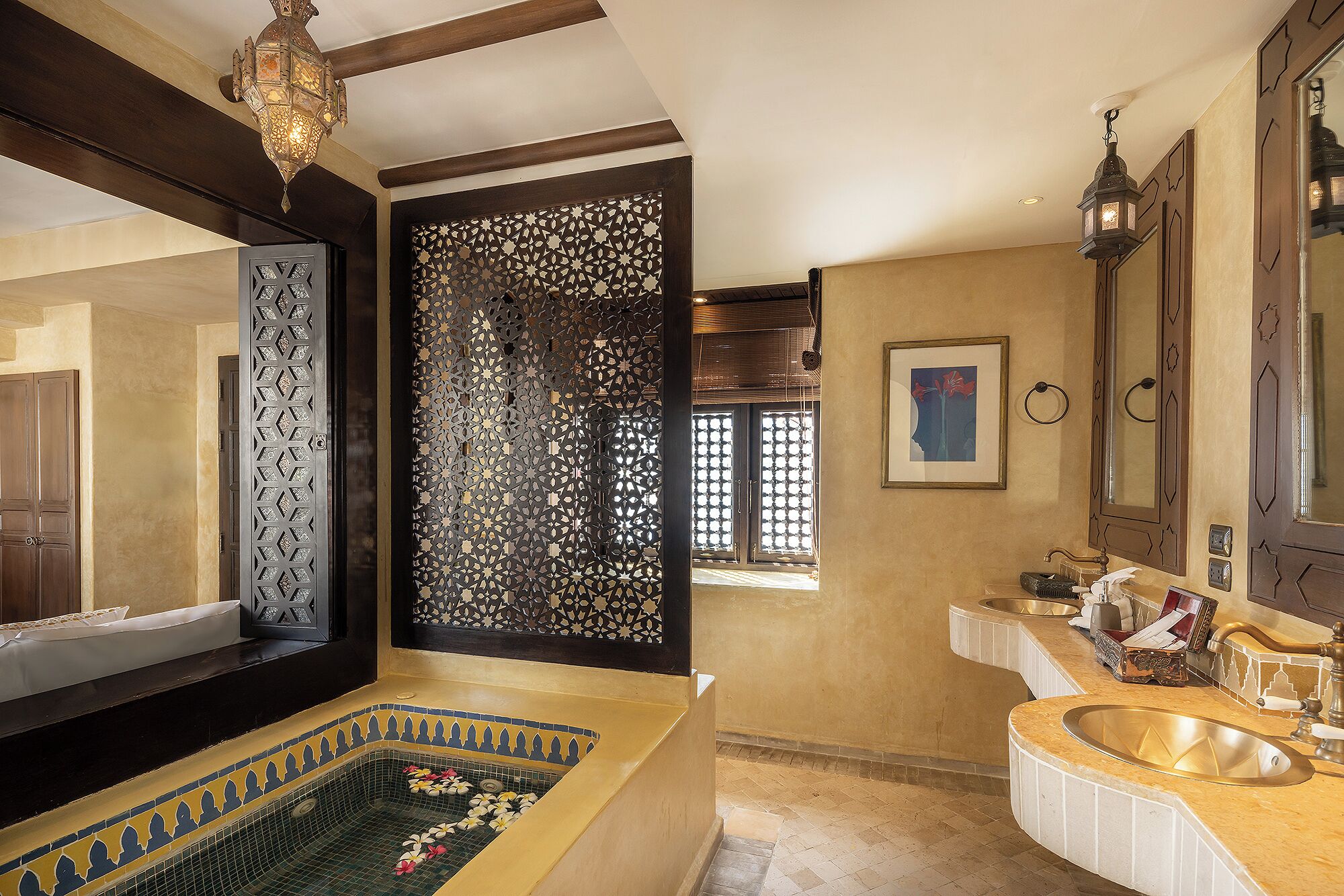 deluxe courtyard | bathroom | rainfall showerhead, designer toiletries, hair dryer, bathrobes