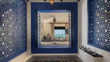 Deluxe Panoramic Seaview | Bathroom | Rainfall showerhead, designer toiletries, hair dryer, bathrobes
