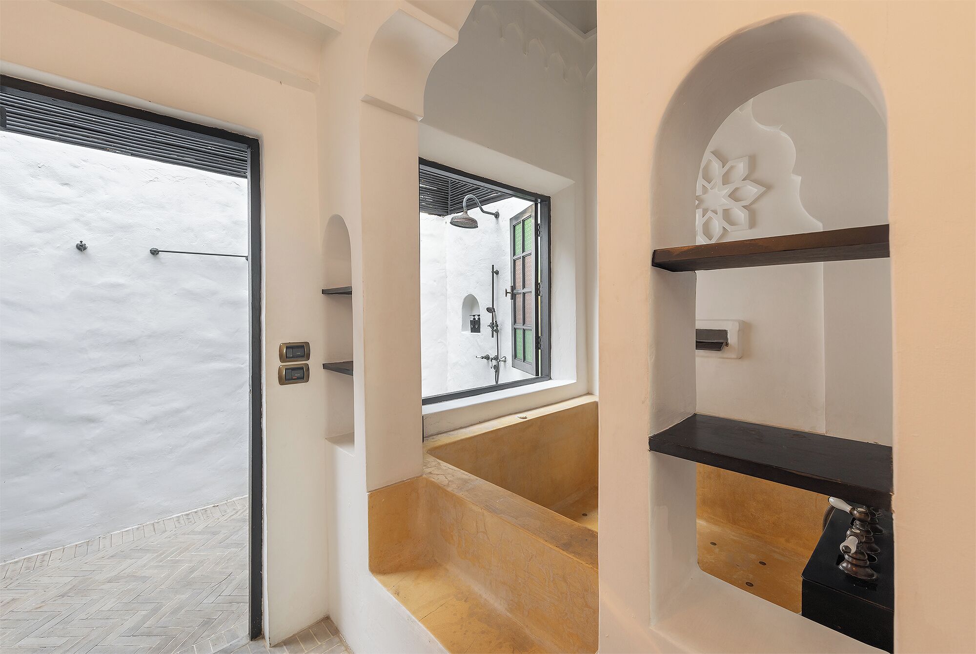 one bedroom morocccan beachfront villa | bathroom | rainfall showerhead, designer toiletries, hair dryer, bathrobes