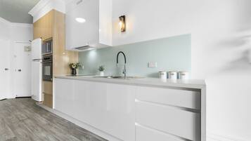 Deluxe Room | Private kitchen | Full-size fridge, microwave, toaster, cleaning supplies