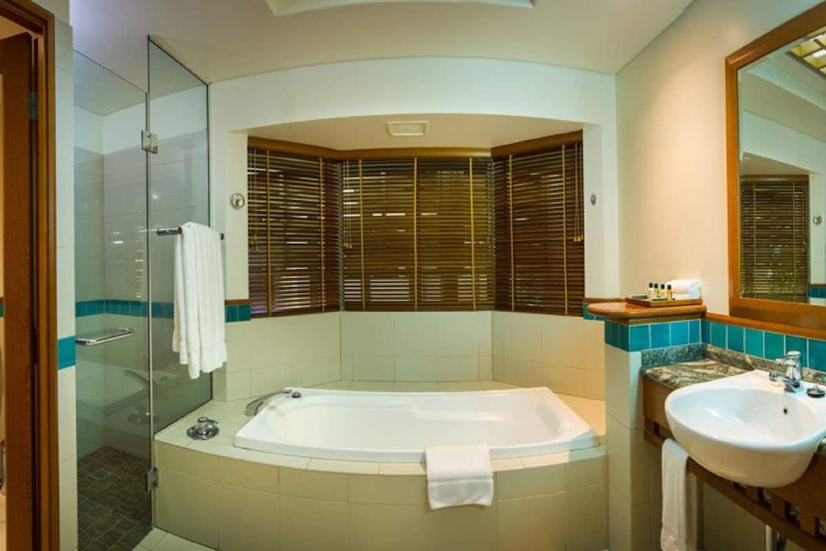 separate bathtub and shower, eco-friendly toiletries, hair dryer, towels