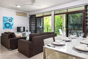 Family Apartment, 3 Bedrooms | Living area | 55-inch Smart TV with digital channels - The Reef Retreat (Palm Cove)