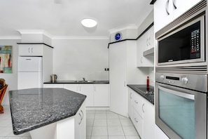 Full-sized fridge, microwave, oven, stovetop - Beachfront Apartments on Trinity Beach (Trinity Beach)