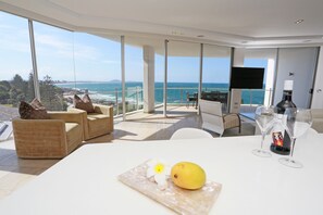 Three Bedroom Deluxe with Ocean Views | Living area | 50-inch TV with satellite channels - Oceans Mooloolaba (Mooloolaba)