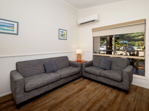 Collaroy Cabin | Living area | 50-inch flat-screen TV with satellite channels, TV