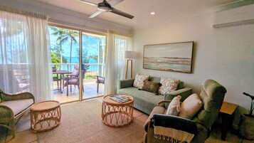 Sails 1 Beachfront | Living area | 30-inch flat-screen TV with cable channels, TV