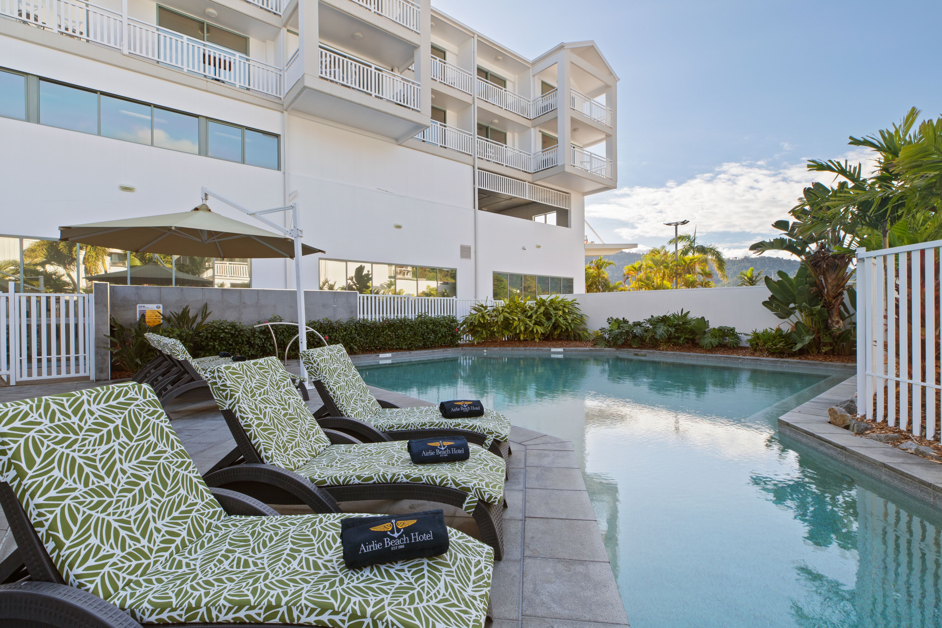 outdoor pool, pool umbrellas, pool loungers