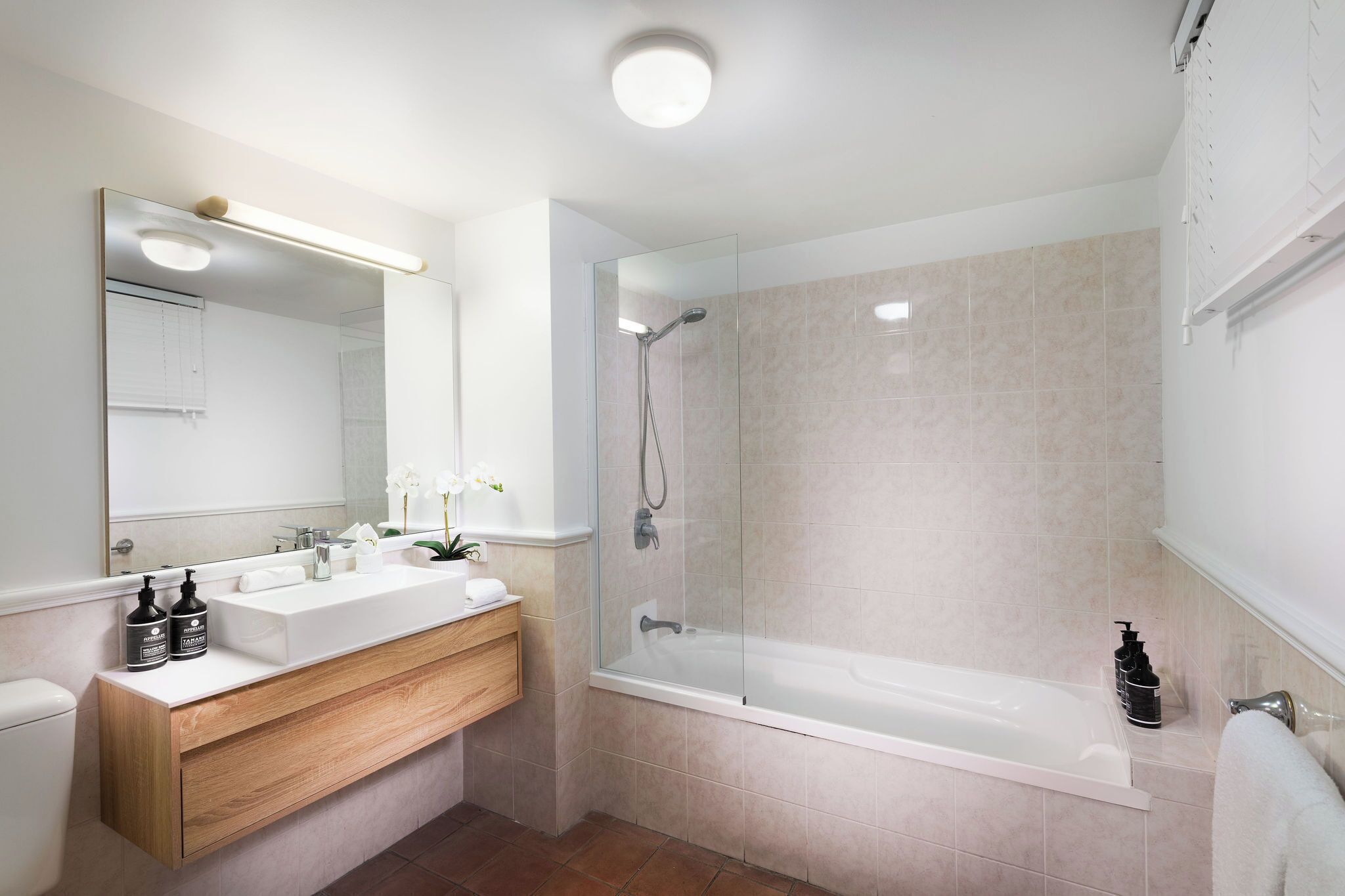 combined shower/bathtub, designer toiletries, hair dryer, towels