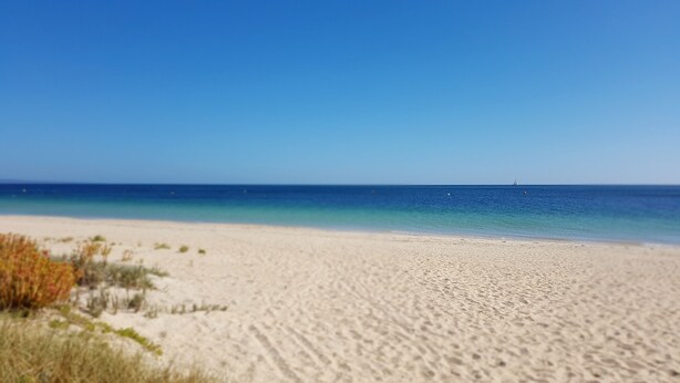A beach with a clear blue sky and calm sea. - Abbey Beach Resort (Broadwater)