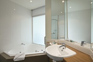 Separate tub and shower, jetted tub, free toiletries, hair dryer