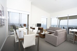 Three Bedroom Apartment | Living area | 39-inch flat-screen TV with digital channels, TV, DVD player