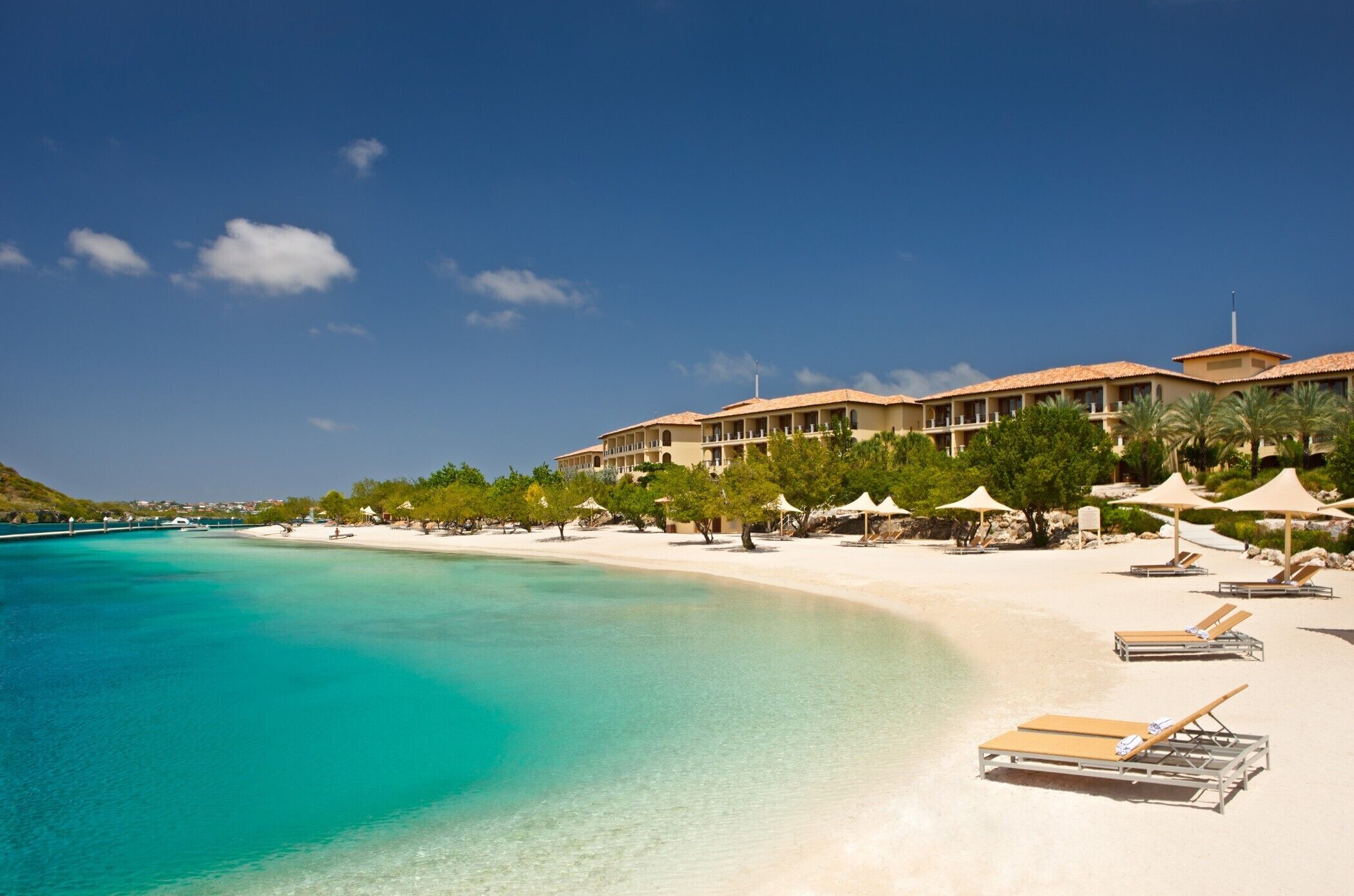 Private beach, white sand, sun loungers, beach umbrellas