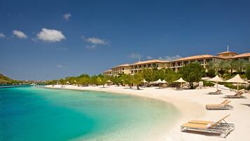 Private beach, white sand, sun loungers, beach umbrellas