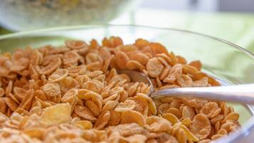 A bowl of cereal with a spoon.