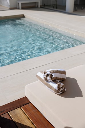Outdoor pool, open 8:00 AM to 7:00 PM, free pool cabanas, pool umbrellas