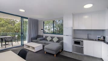 Apartment, 1 Bedroom with Shower | Living area | Flat-screen TV, DVD player