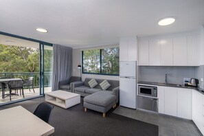 Apartment, 1 Bedroom with Shower | Living area | Flat-screen TV, DVD player