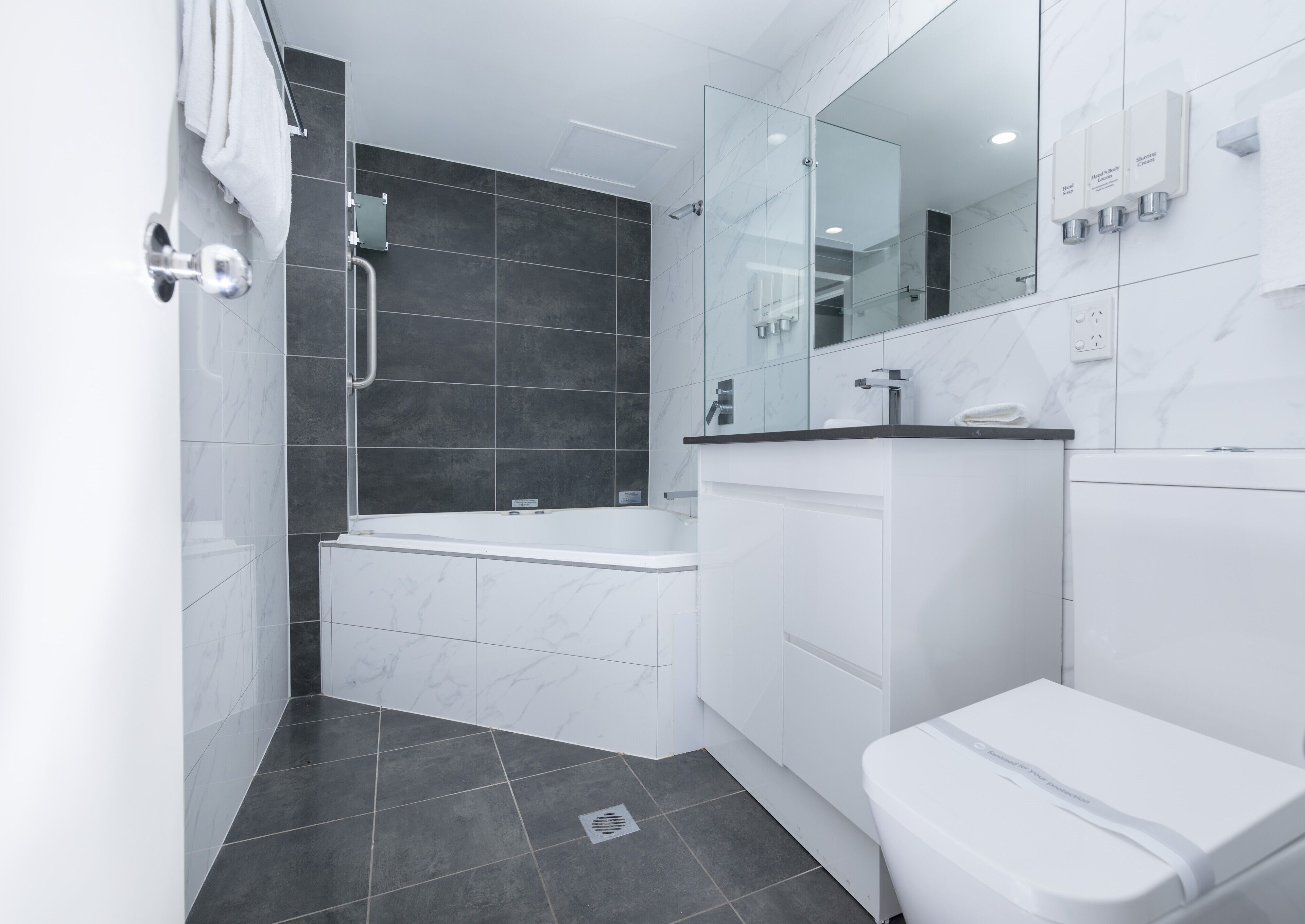 deluxe 2 bedroom, bay view | bathroom | hair dryer, towels