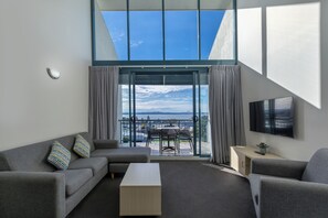 Deluxe Executive Apartment | Living area | Flat-screen TV, DVD player - The Landmark Resort Nelson Bay (Nelson Bay)