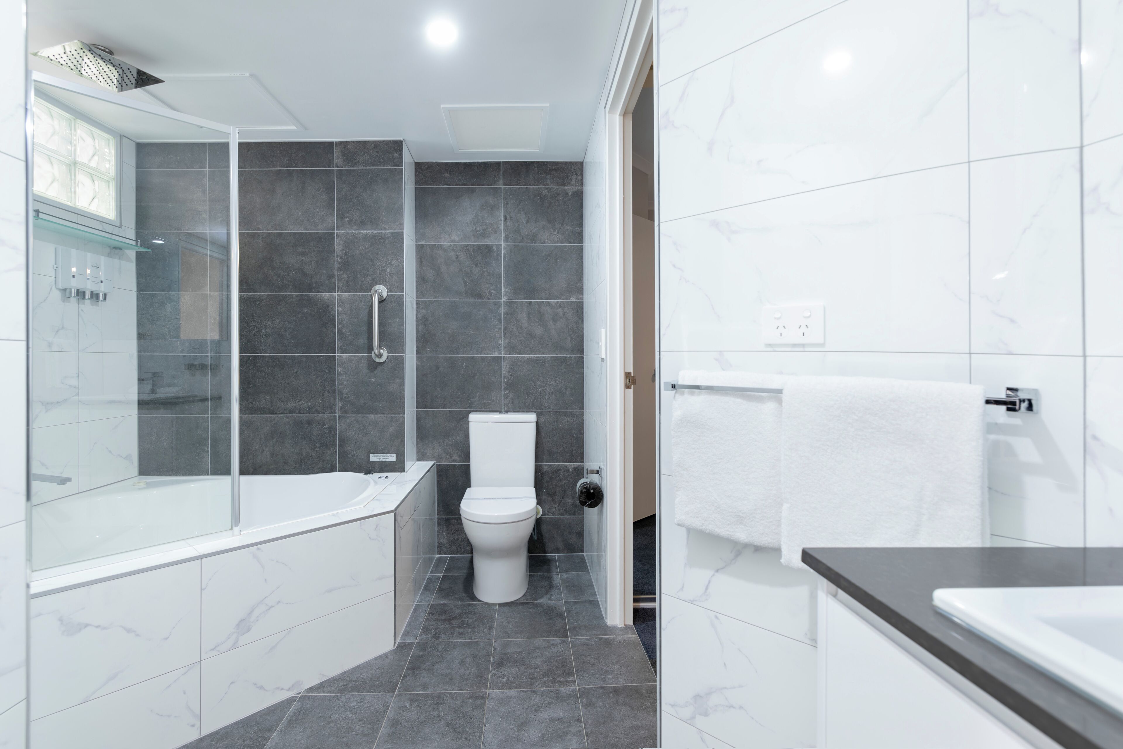 apartment, one bedroom deluxe | bathroom | hair dryer, towels