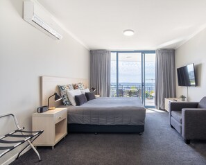 Deluxe Studio, 1 King Bed, Kitchenette, Partial Ocean View | Blackout drapes, iron/ironing board, free WiFi, bed sheets - The Landmark Resort Nelson Bay (Nelson Bay)