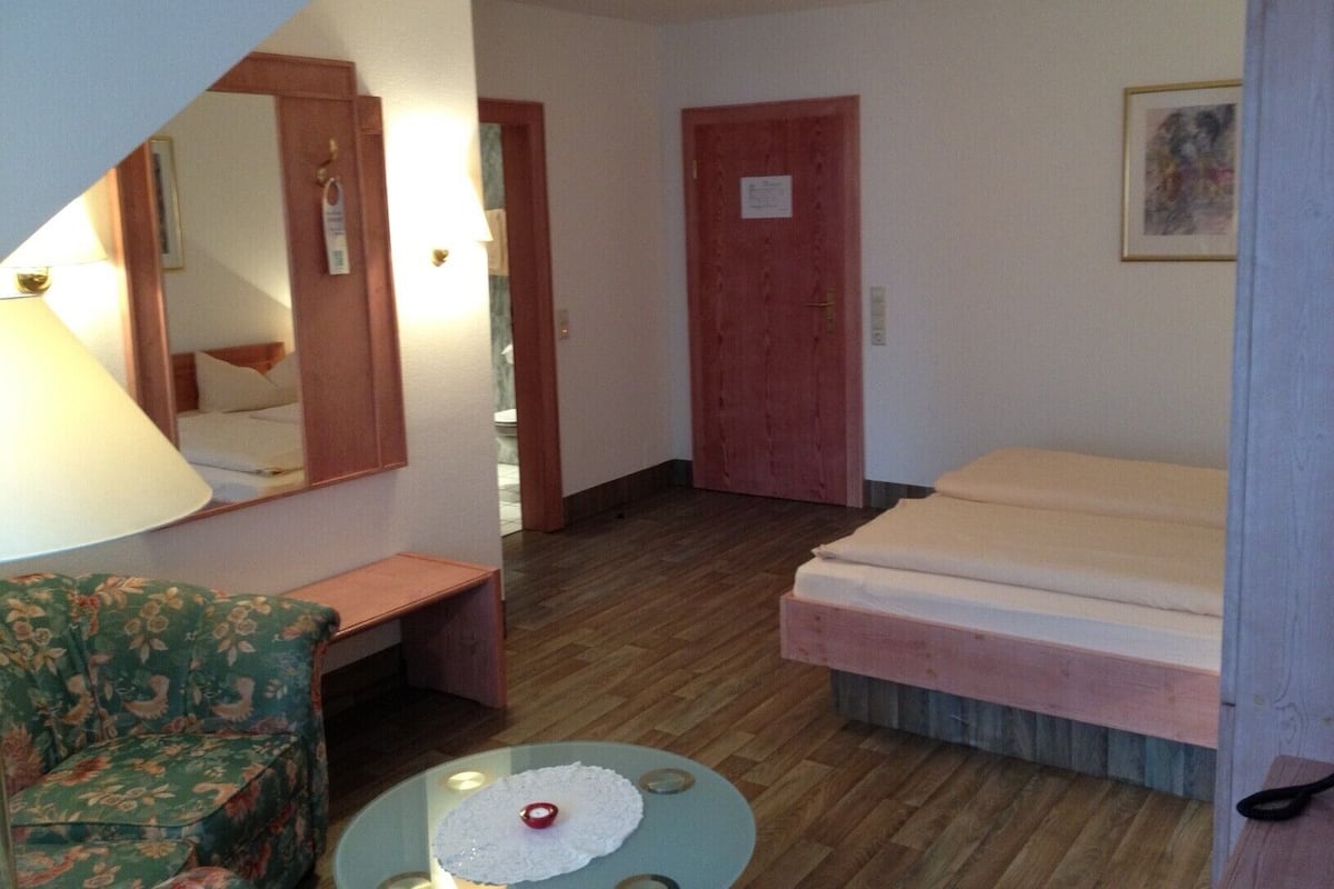 Deluxe Double Room | Living area | 35-inch flat-screen TV with satellite channels, TV, toys