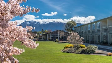 Experience serene views of the surrounding mountains from this tranquil hotel, set amidst a beautifully maintained garden with flowering trees.