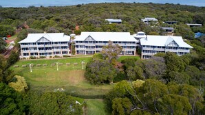 A large, modern building with multiple balconies and a spacious lawn area. - Seashells Yallingup (Yallingup)