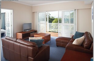 Deluxe Room, 1 Bedroom | Living area | 55-inch flat-screen TV with cable channels, LCD TV, DVD player