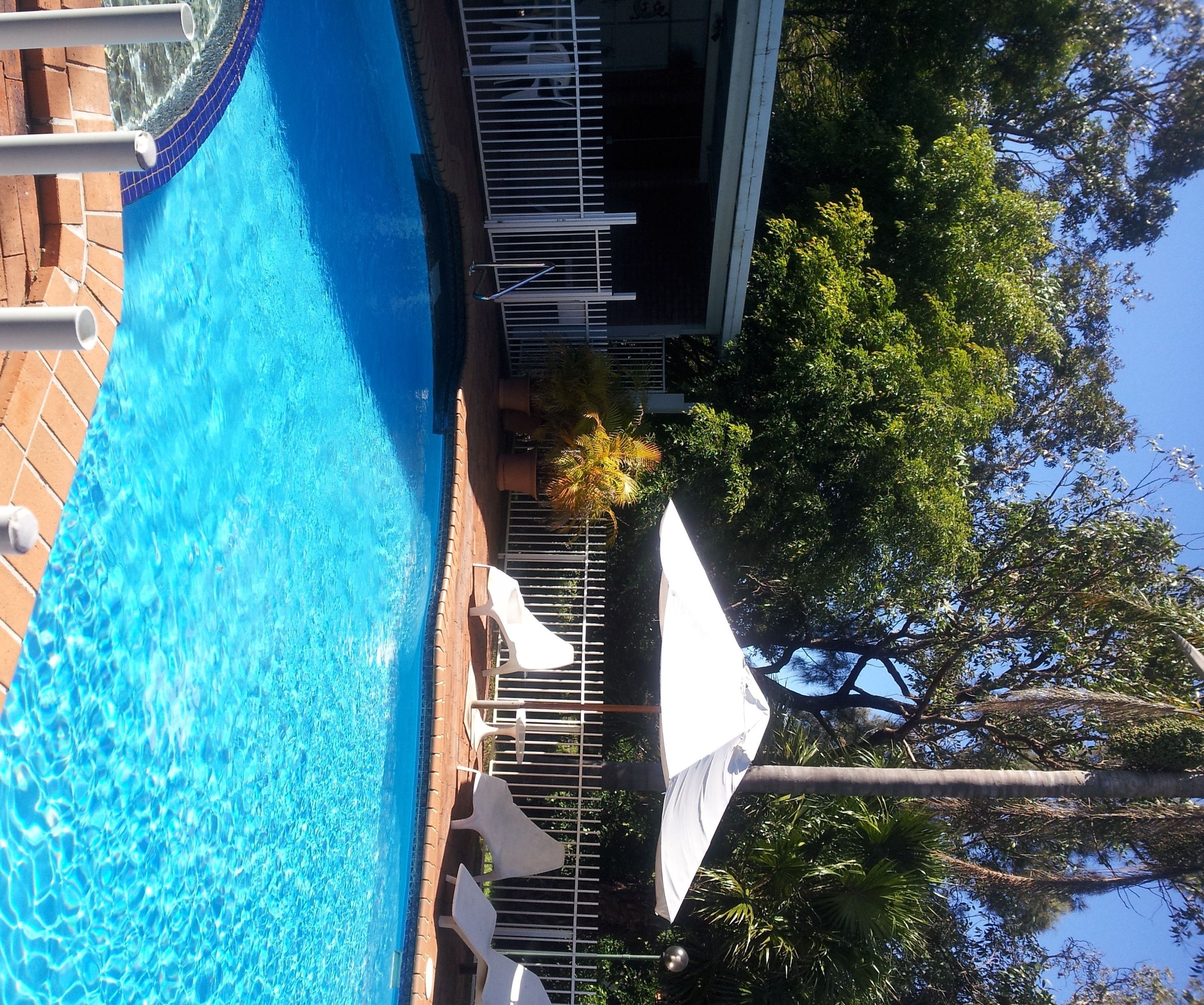 outdoor pool, pool umbrellas, pool loungers