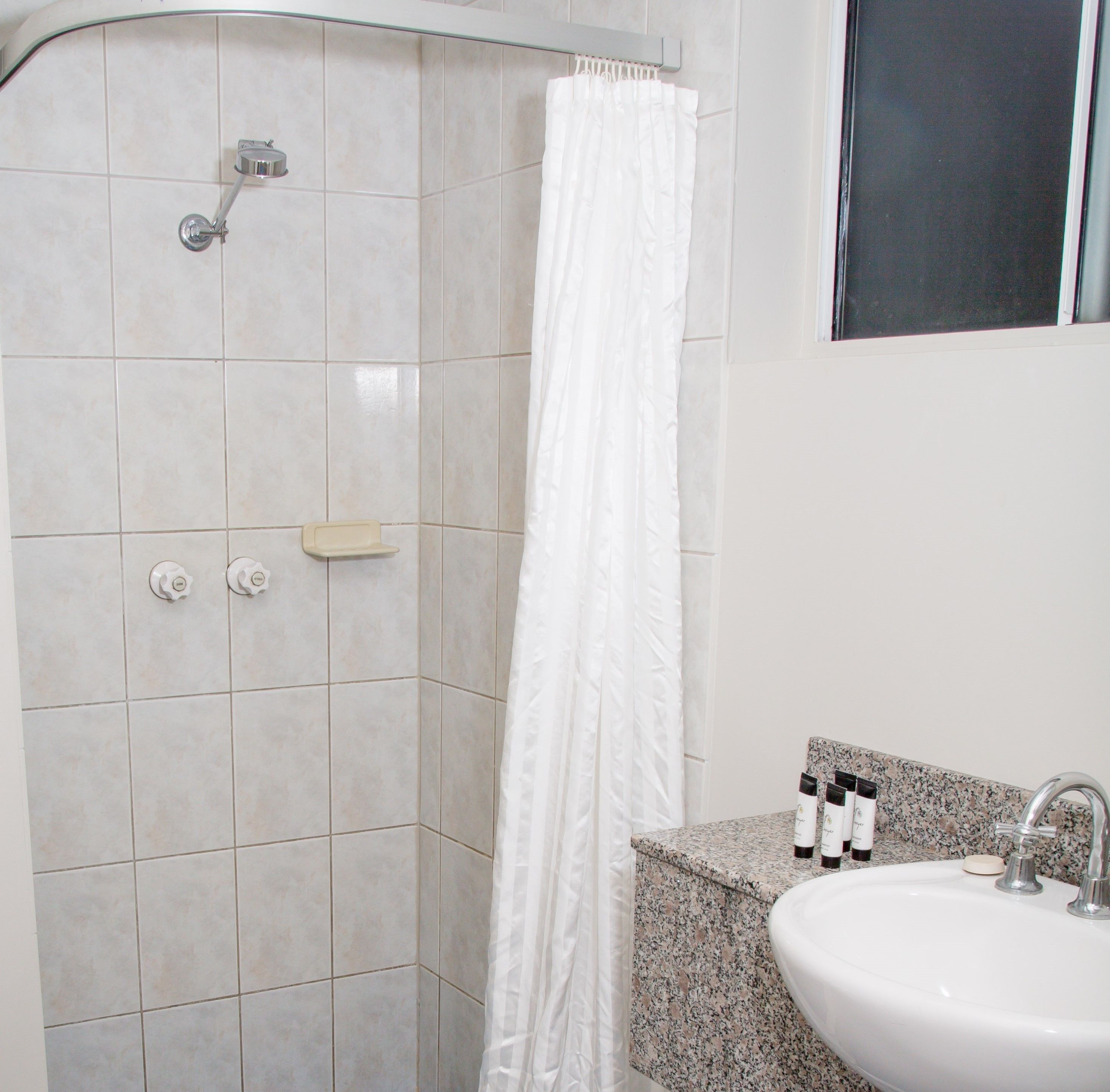 shower, hair dryer, toilet paper