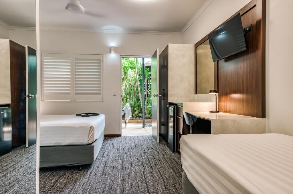 Premium bedding, desk, laptop workspace, iron/ironing board