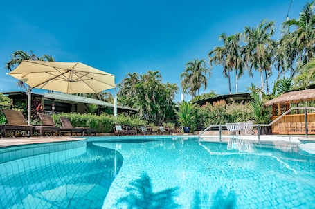 Outdoor pool, open 6 AM to 10 PM, pool umbrellas, sun loungers. Palms City Resort