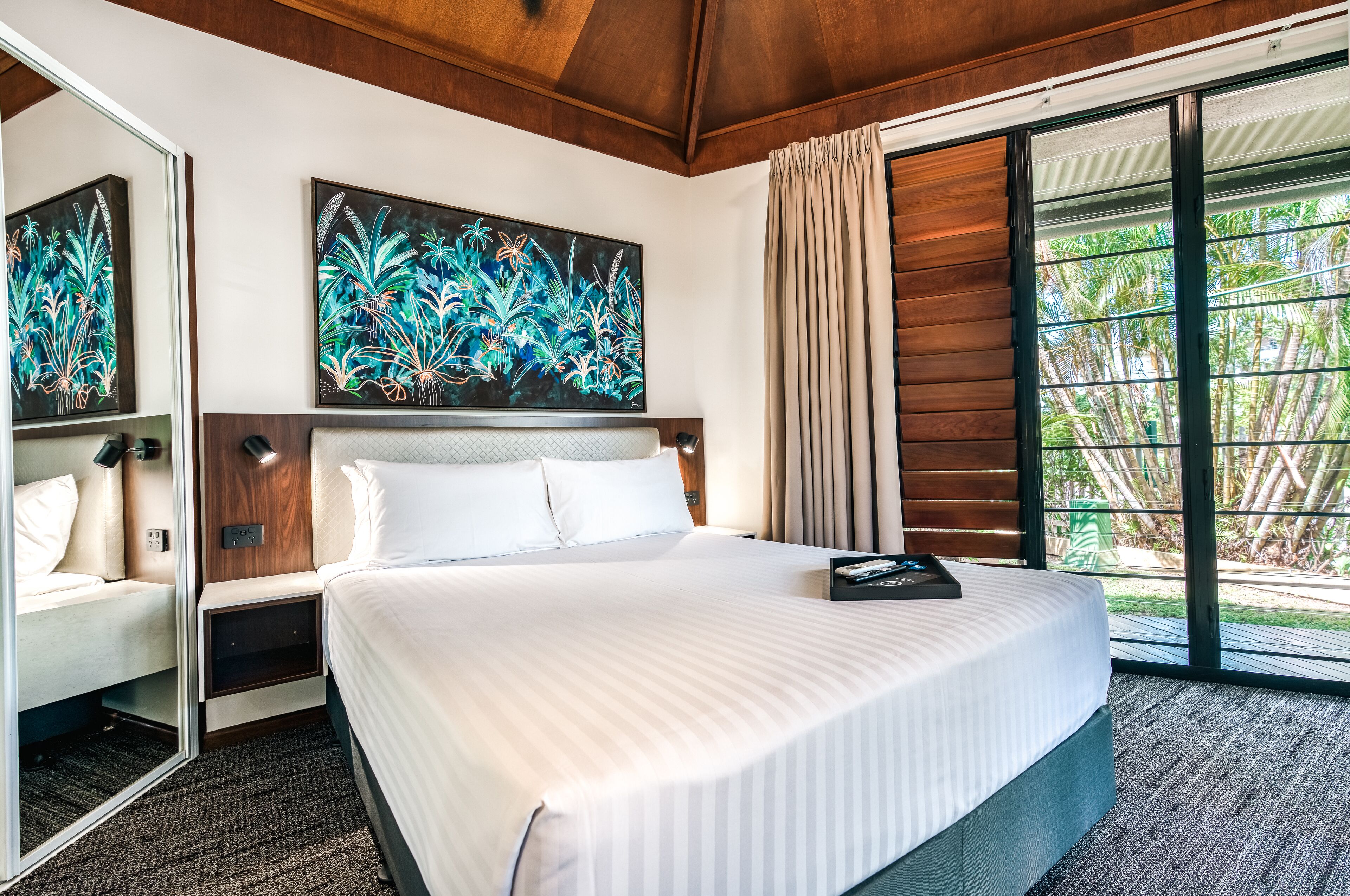 Premium bedding, desk, laptop workspace, iron/ironing board