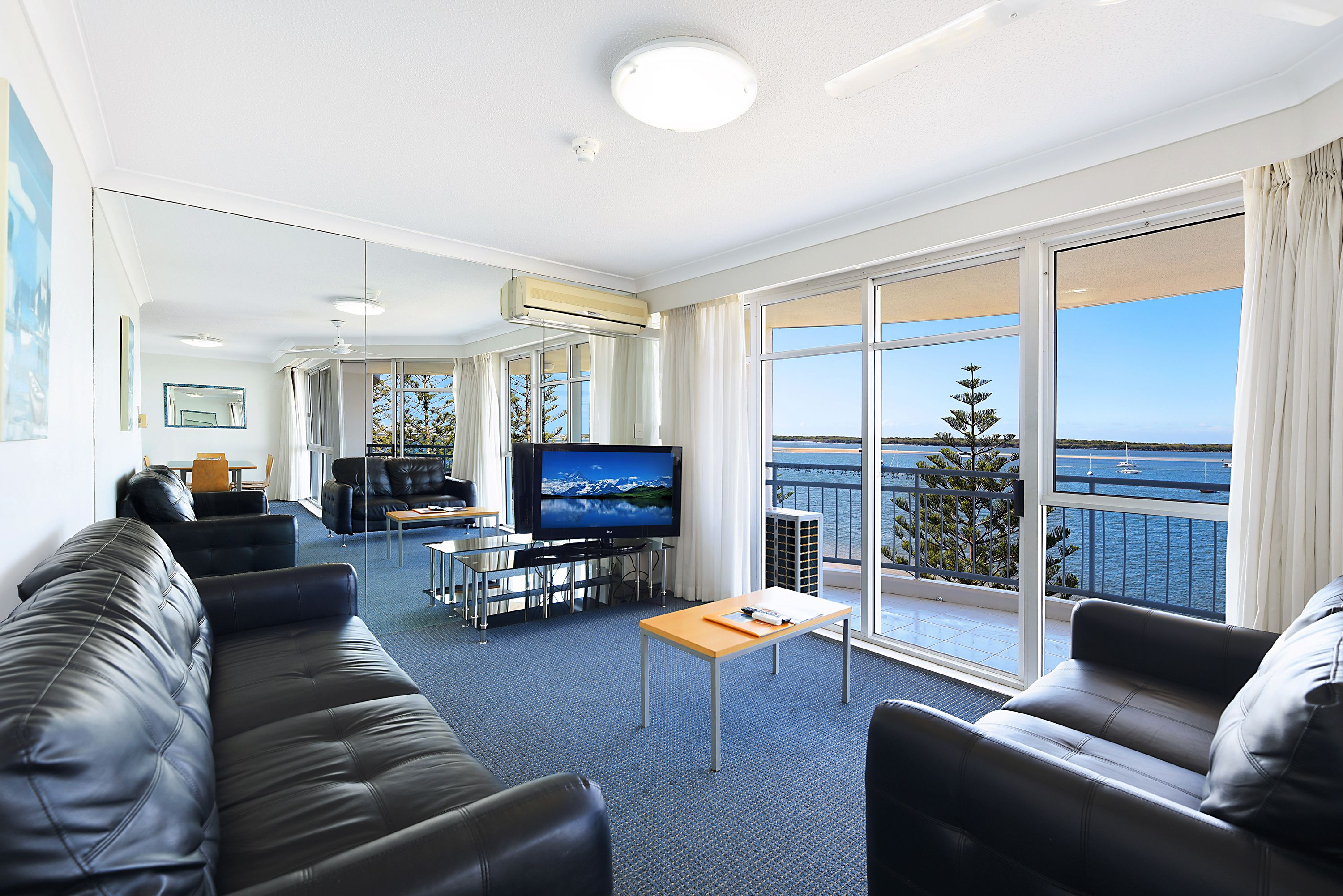 2 bedroom waterfacing spa | living area | flat-screen tv