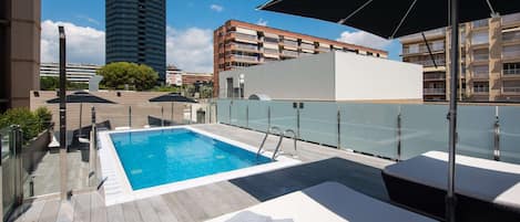 Seasonal outdoor pool, pool umbrellas, pool loungers