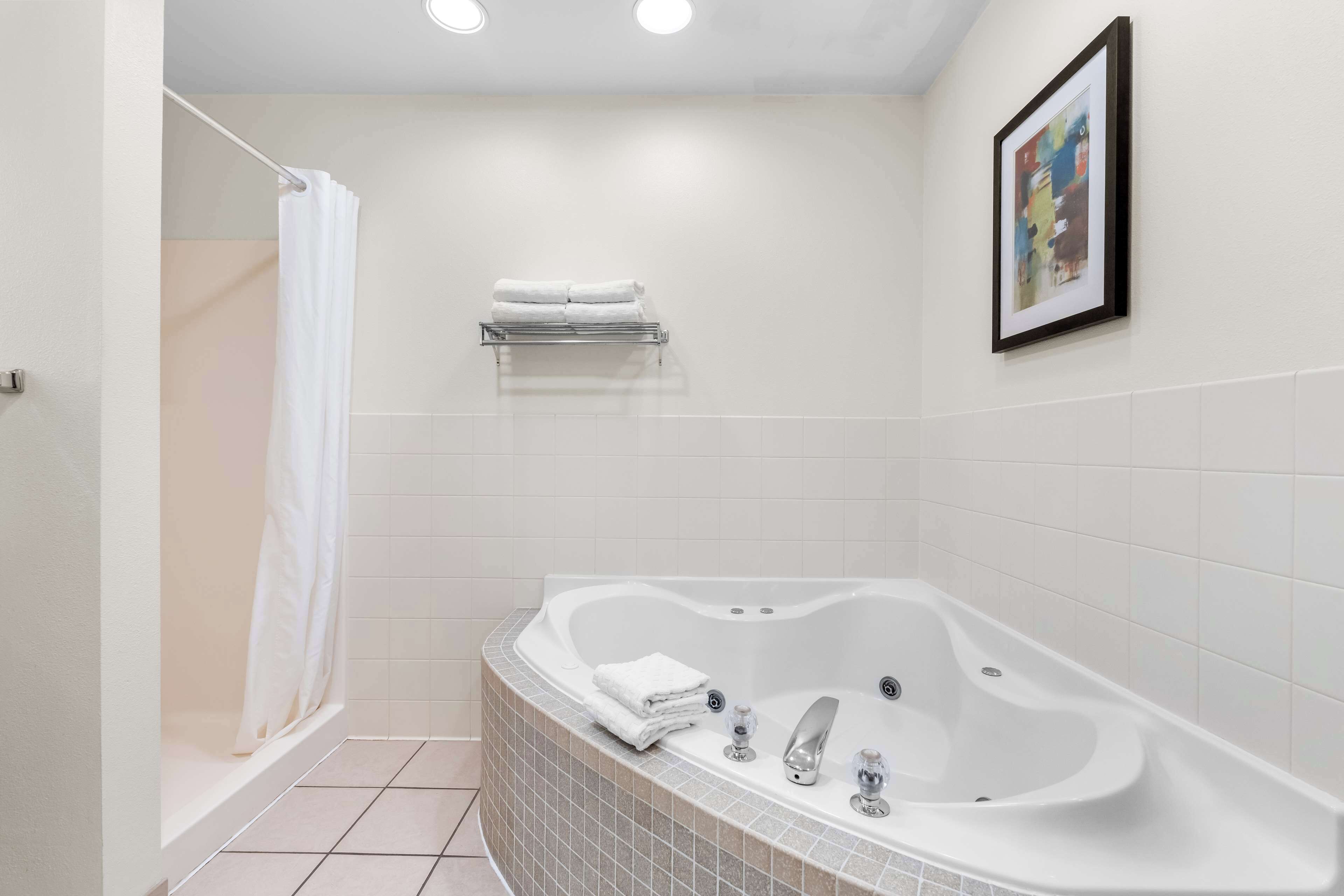 suite, 1 king bed with sofa bed, non smoking, jetted tub (with sofabed) | bathroom | free toiletries, hair dryer, towels, soap