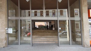 A building entrance with a glass facade, a staircase leading to an upper level, and a view of the street below. - Opera Residence (Budapest)
