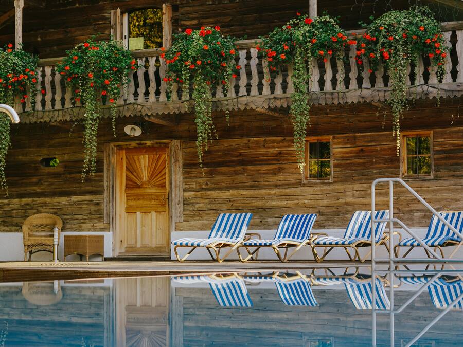 Outdoor pool, open 9:00 AM to 8 PM, pool loungers