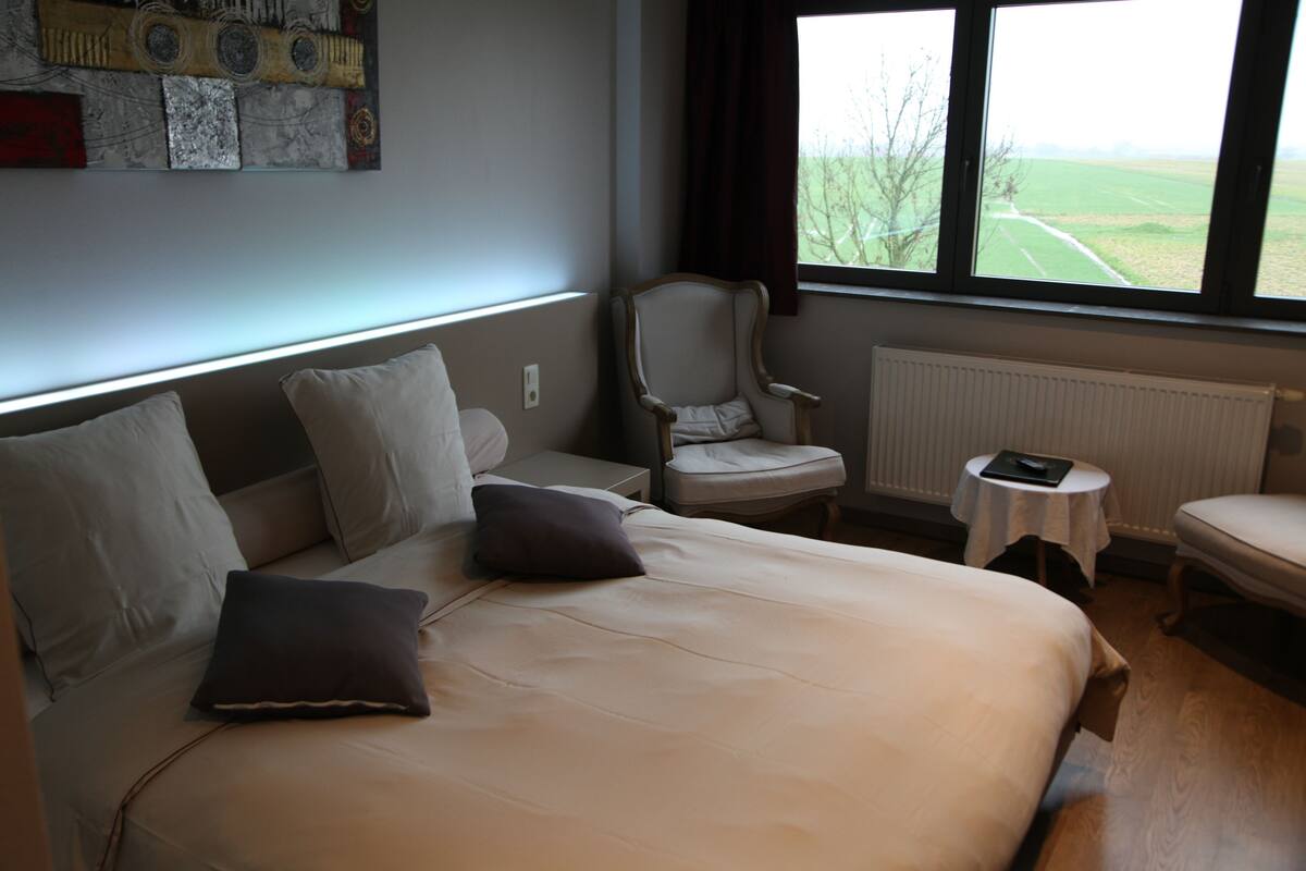 select comfort beds, desk, laptop workspace, blackout curtains