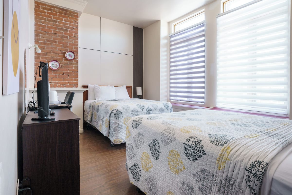 Family Room, 2 Double Beds | Individually decorated, iron/ironing board, free WiFi, bed sheets