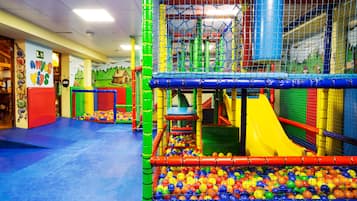 Kids can play and climb in this enclosed play area featuring a ball pit, slides, and climbing nets.