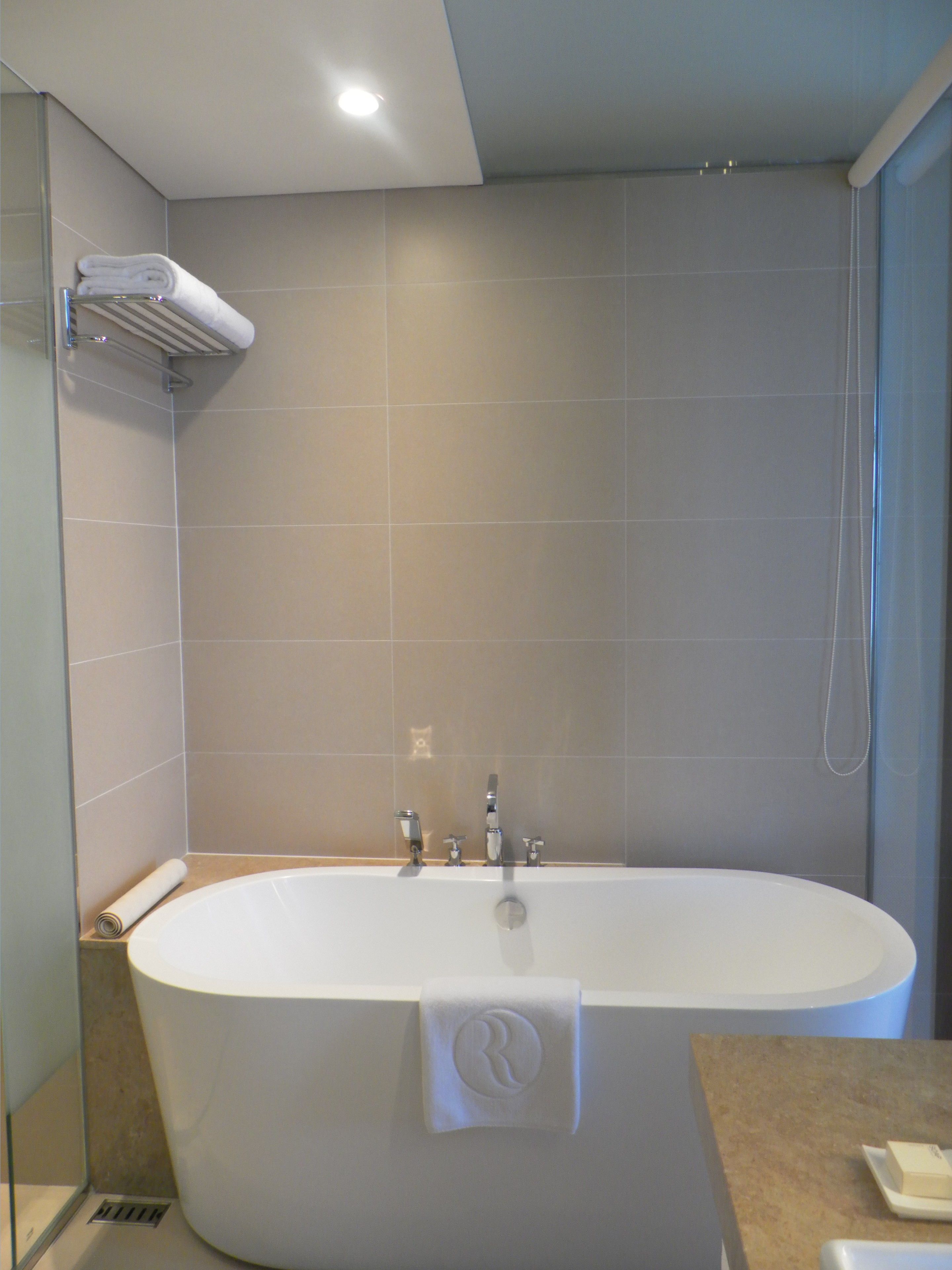 premier room, 1 king bed | bathroom | deep-soaking bathtub, designer toiletries, hair dryer, bathrobes