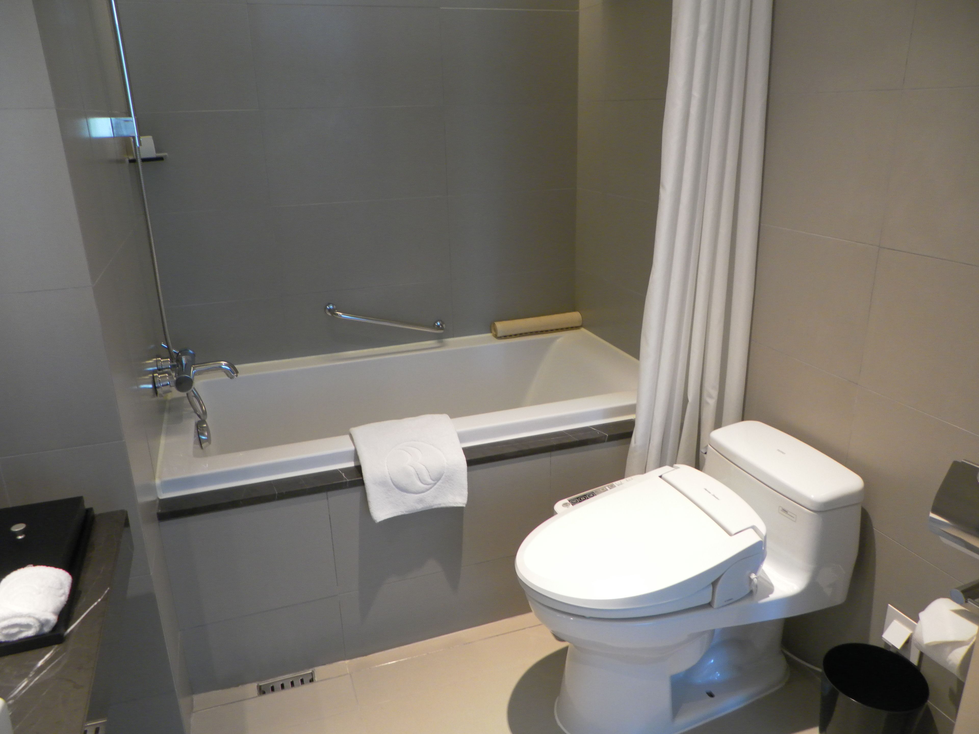 deep-soaking bathtub, designer toiletries, hair dryer, bathrobes